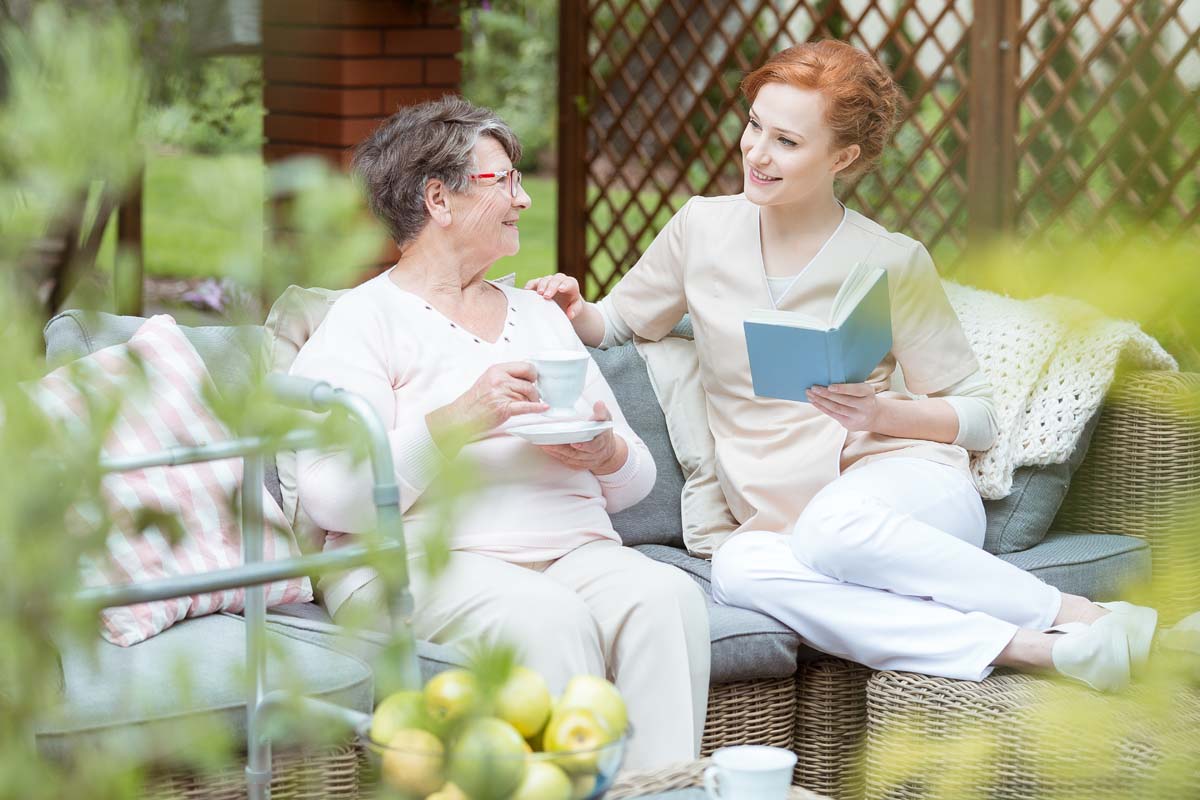 Volunteer spending time with senior